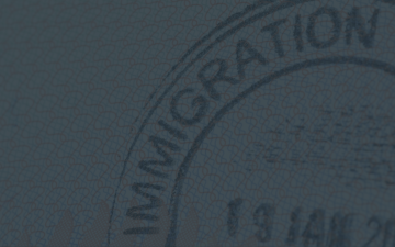 Immigration Stamp on grey background.