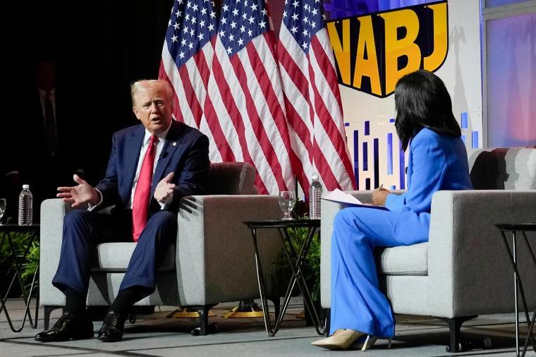 Republican presidential candidate former President Donald Trump, left, moderated by ABC's Rachel Scott, speaks at the National Association of Black Journalists convention, July 31, 2024, in Chicago.