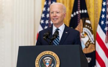 President Joe Biden smiles during his first official press conference Thursday, March 25, 2021, in the East Room of the White House. (Official White House Photo by Adam Schultz)