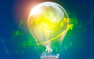 Lightbulb displaying energy saving and financial concepts with cutting-edge technology and creativity By Surasak_Adobe Stock