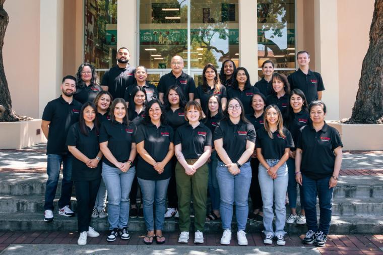 Human Resources staff members pose for a group photo. 