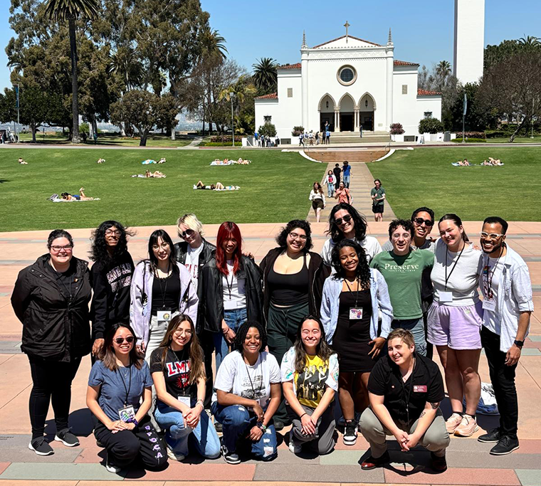 A delegation of SCU students and staff pose in front of Loyola Marymount University's chapel.