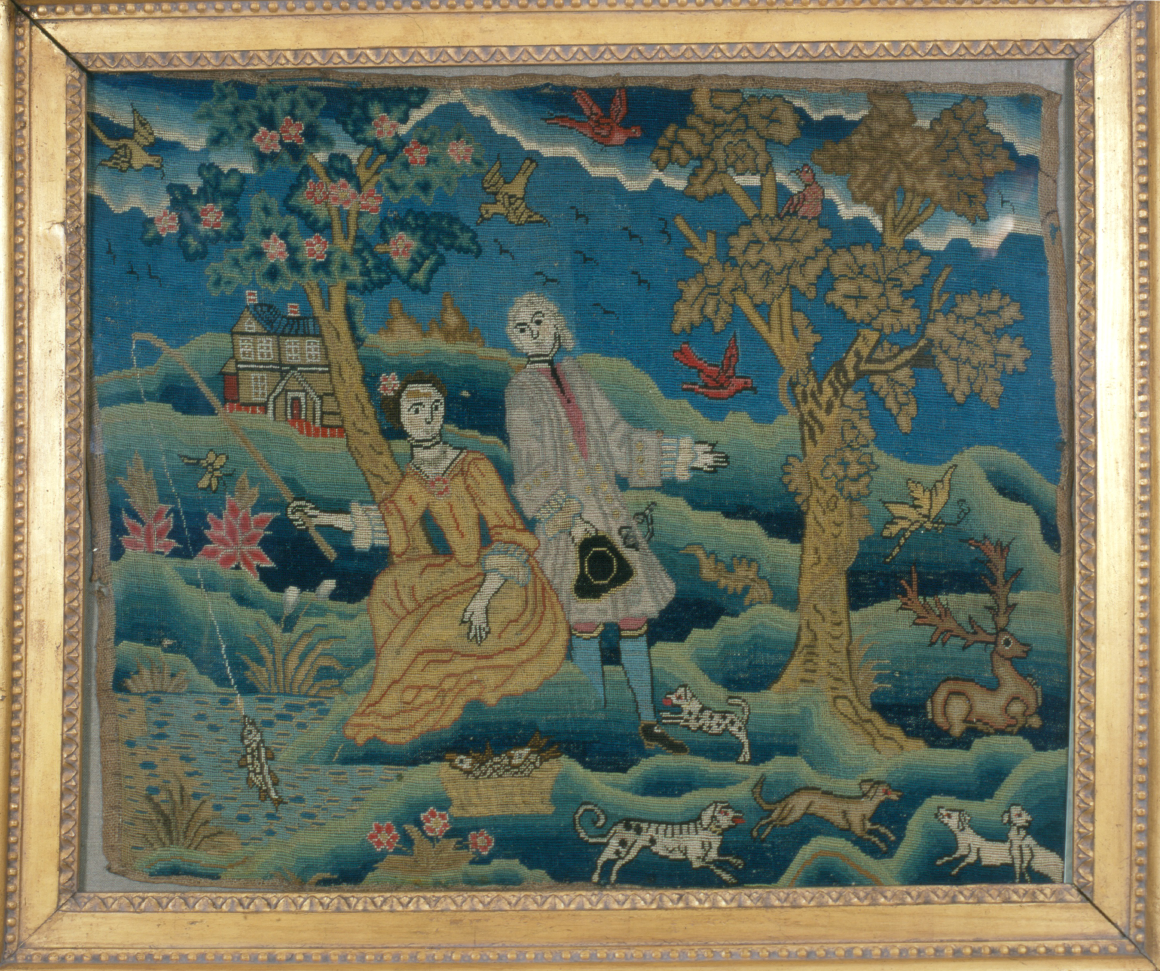 A framed embroidery of a woman fishing and a male suitor vying for her attention.