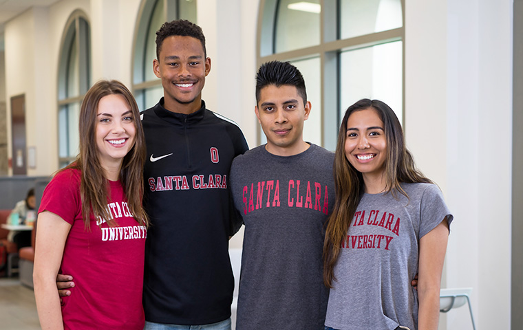 Students wearing SCU shirts posing on campus image link to story