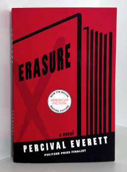 The book Erasure by Percival Everett is propped against a wall