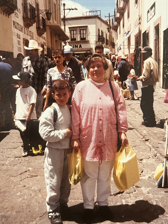 Guadalupe Hayes Mota standing in street with family member