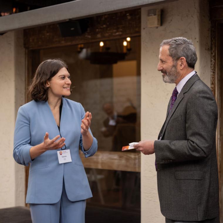 Jim Glaser speaking with an SCU community member.