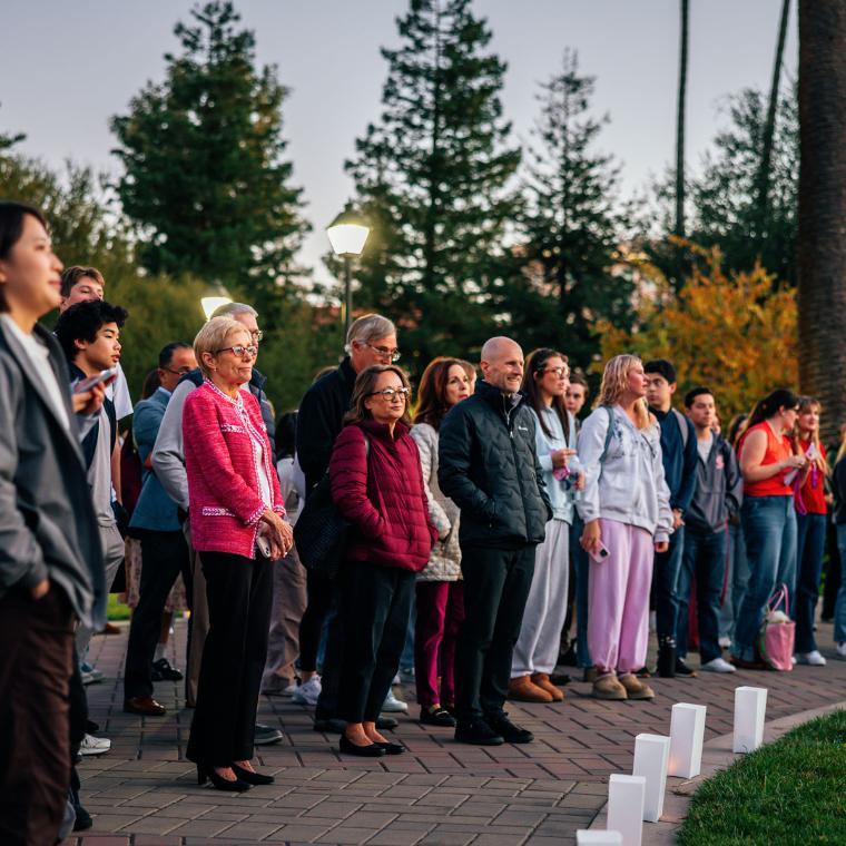 President Julie Sullivan standing with SCU community members and looking ahead