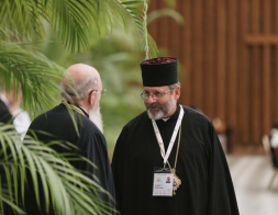 orthodox priest talking with another priest