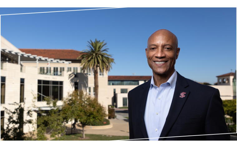 Dean Grier in front of Lucas Hall, home of SCU's Leavey School of Business