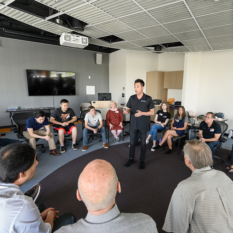 Picture of man talking to group of people for Bronco Ventures 