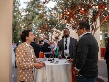 Two people talking at Demo Day Event