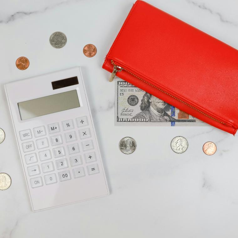 a red wallet and coins 