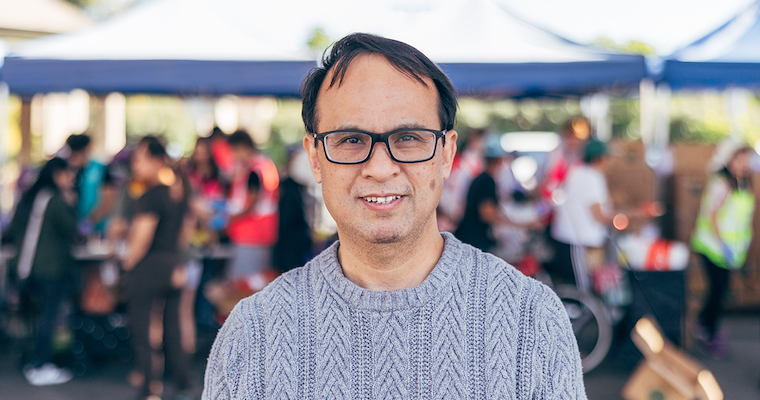 Associate teaching professor, Long Le, volunteers at Our Lady of Refuge