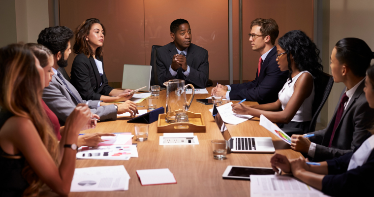 Boardroom of diverse professionals image link to article