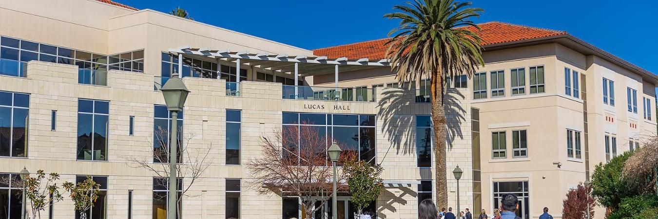 Graduate students walking into Lucas Hall, home of Santa Clara's Leavey School of Business