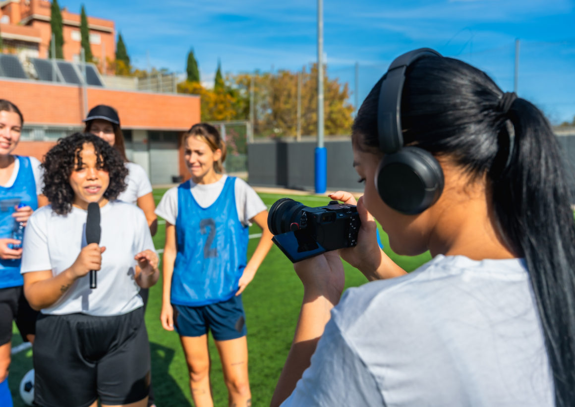 Sports content creator filming with team