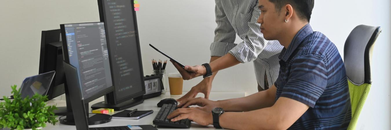 Young programmers working together on a project for their MS courses