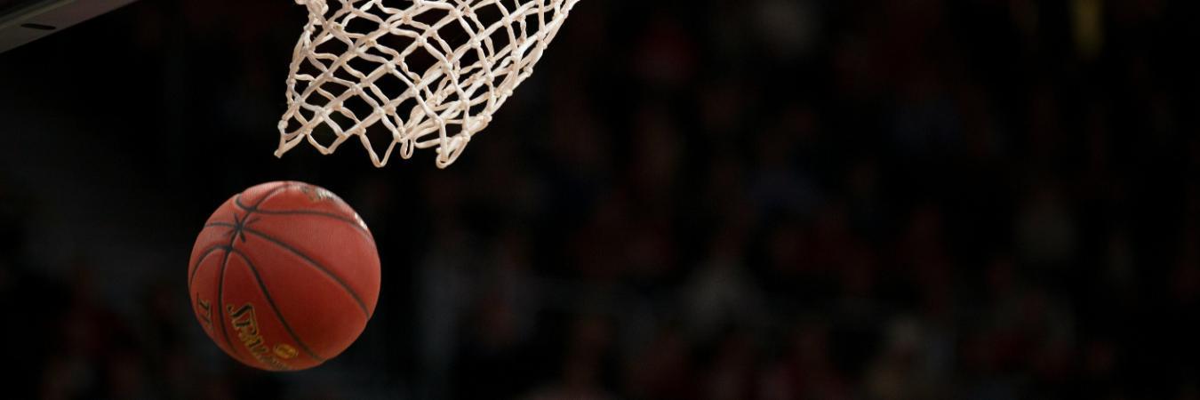 Ball under basketball rim after basket