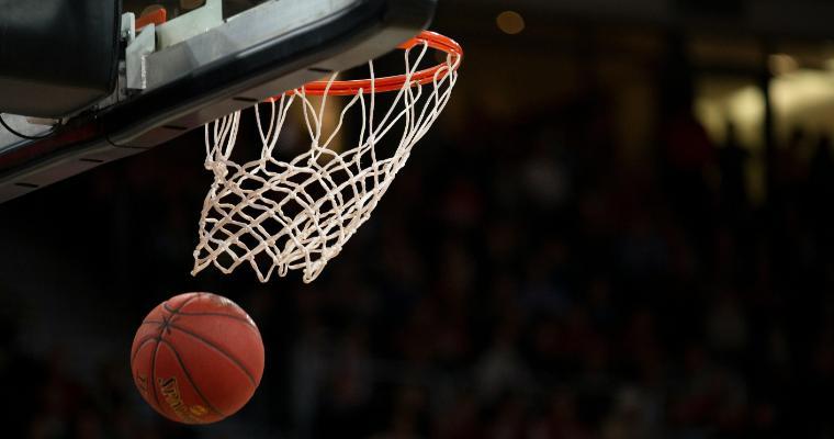 Ball under basketball rim after basket