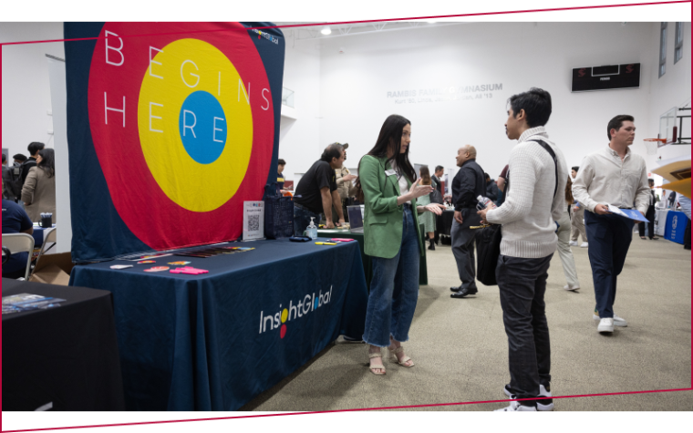 Leavey student networking with potential employers at an SCU career fair