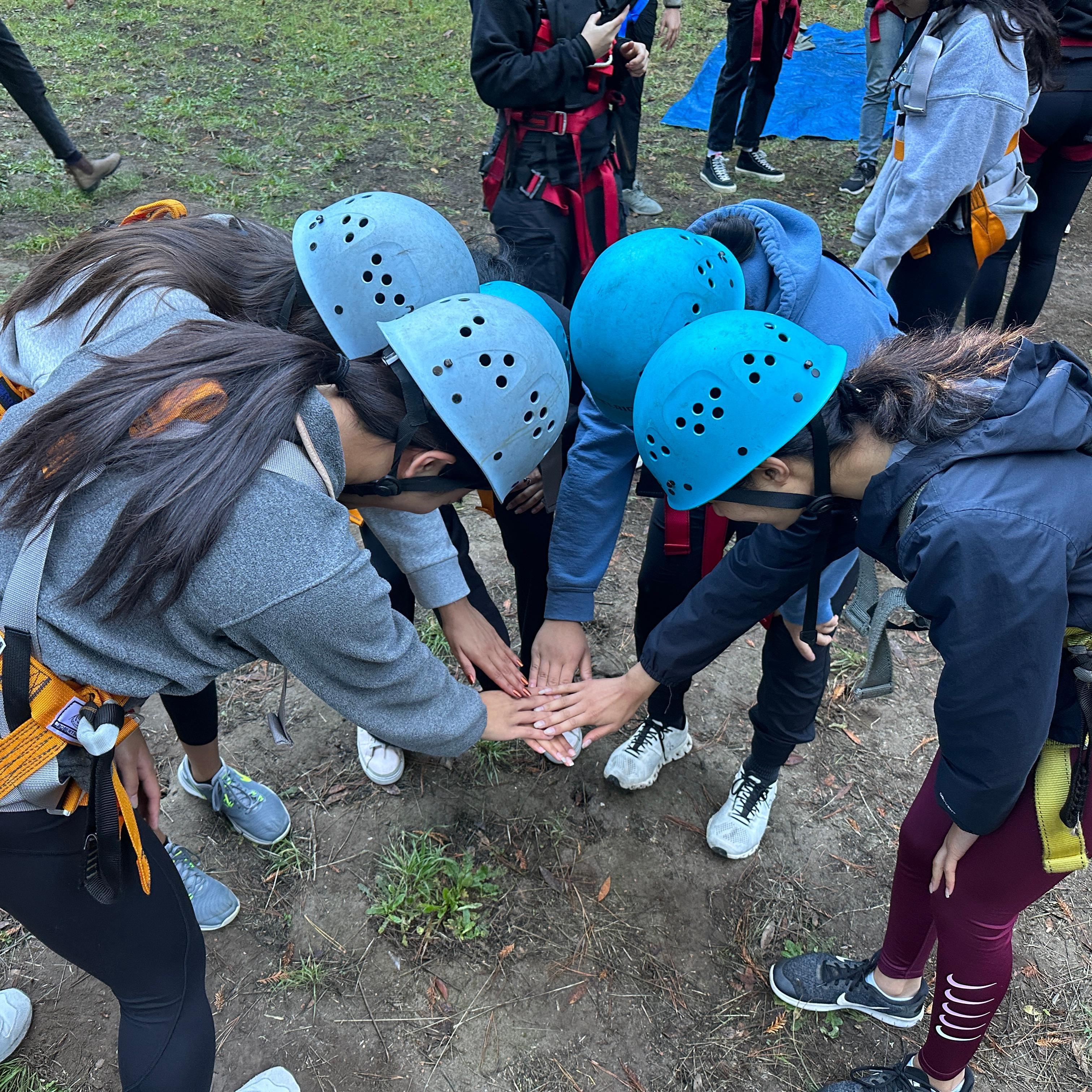 ACE students collaborating during a ropes course 