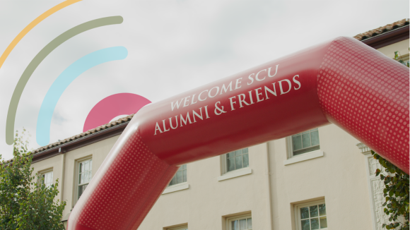 A red inflatable arch reading