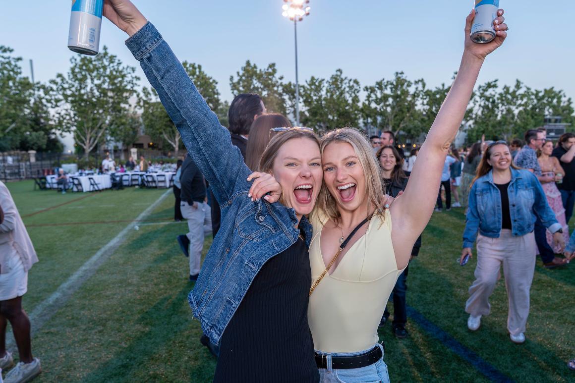 Two women smiling and posing for the camera at Grad Bash 2025.