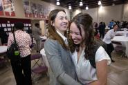 Two students laughing and celebrating