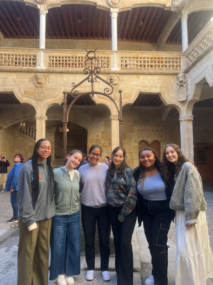 Decorative; group of students posing in front of a building