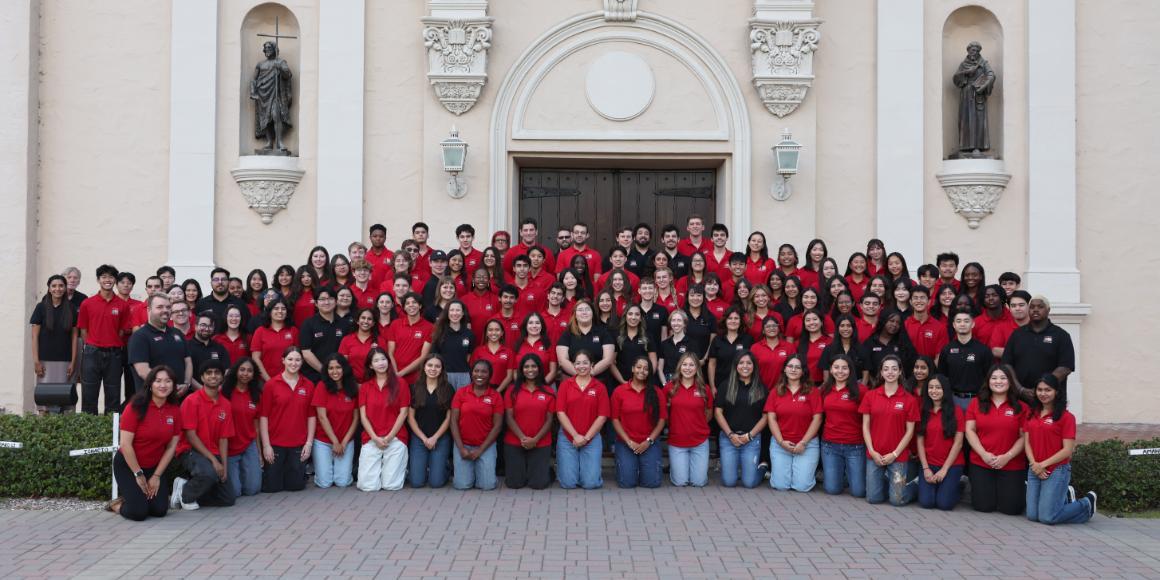 The majority of the residence life staff wearing red or black polos