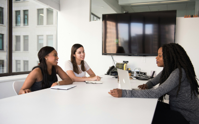 group of students talking at a table 