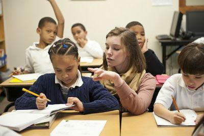Students in a classroom actively engaged in learning and discussion.