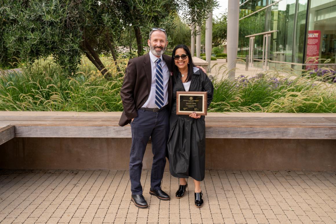 Sharmila Lodhia and Jim Glaser posing for a picture