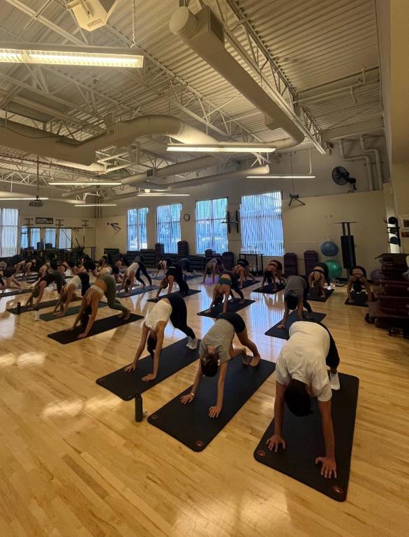 fitness class with 21 students in the multipurpose room