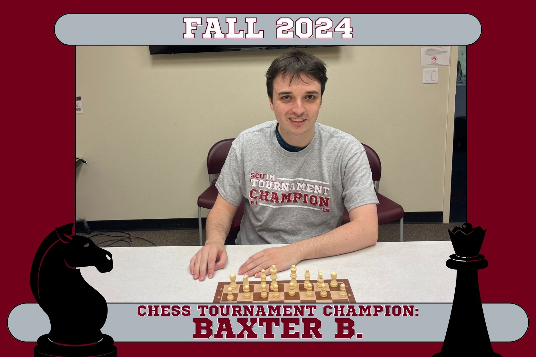 Photo of Fall 2024 IM Chess Tournament Champ, Baxter, posing in the Malley Center Conference room wearing his tournament champion t-shirt.