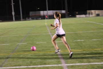 Student playing soccer