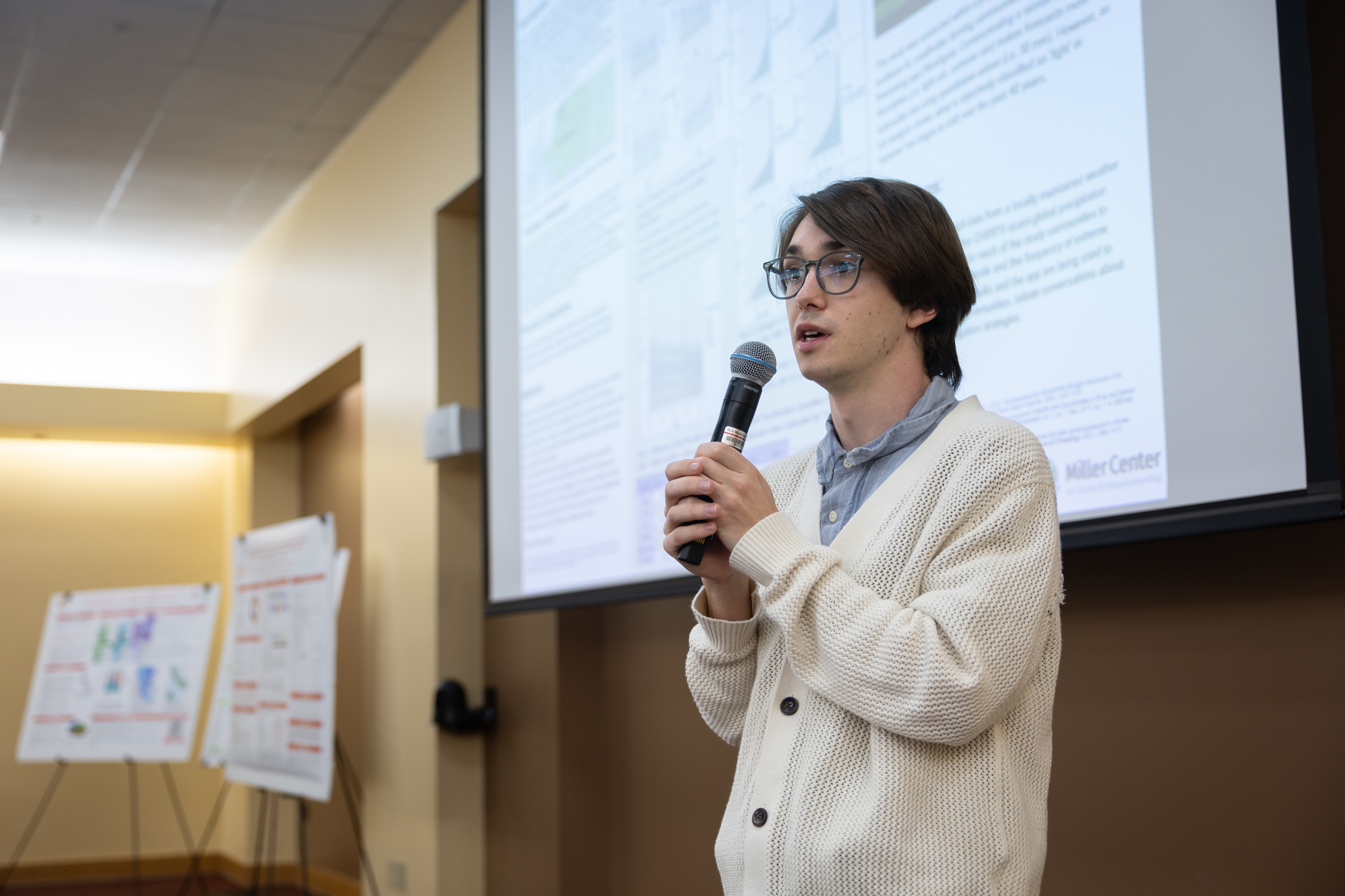 A student shares their research during the 2025 Sustainability and EJ Symposium.