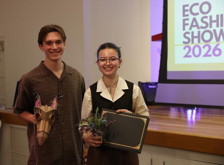 EcoFashion Show 2026: Student Designer and Model holding award for design The Stag