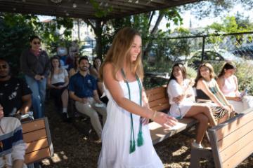 2025 Sustainability Celebration: A student walks past an audience to receive an award.
