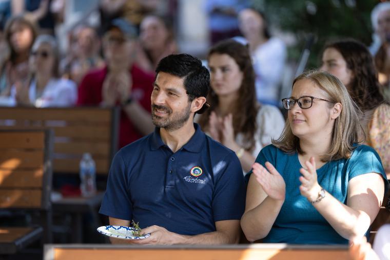 2025 Sustainability Celebration: Audience clapping under the pergola