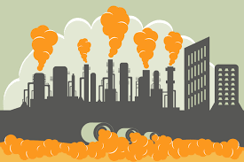 grey smokestacks pumping orange plumes of smoke into sky