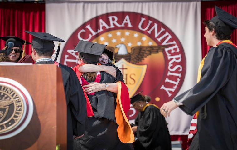 Graduates on stage during USC Aiken University's 2016 commencement ceremony. image link to story