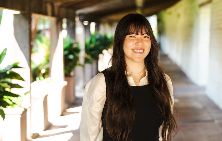 Ariana Yamasaki, 2025 Fulbright recipient, poses in the hallway near the Adobe Lodge.