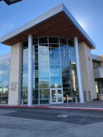 Modern building front entrance with large glass windows titled Schott AEC.