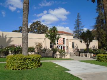 Exterior view of De Saisset Museum with garden and pathways.