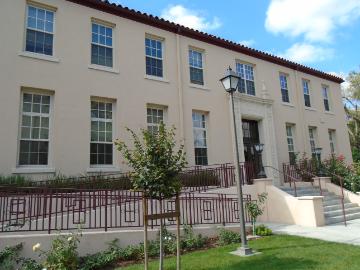 The image shows Donohoe Alumni House exterior with a staircase and entrance.