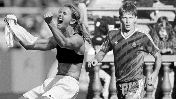 Black and white image of two blended pictures. On the left, a young woman is cheering and holding a soccer jersey in hand. On the right a young man in a soccer uniform runs along a soccer field.