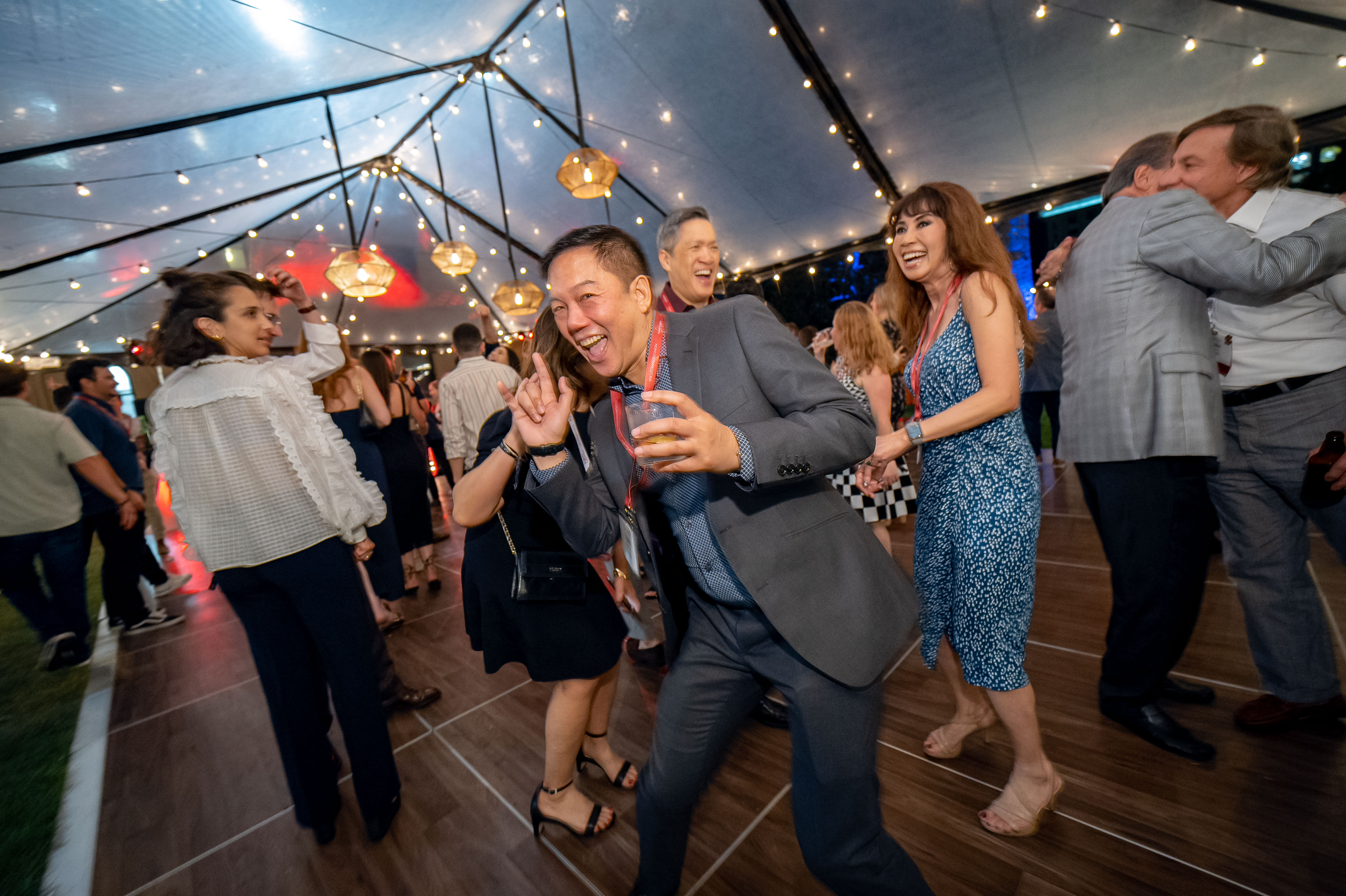 Alumnus dancing in a group at Grand Reunion