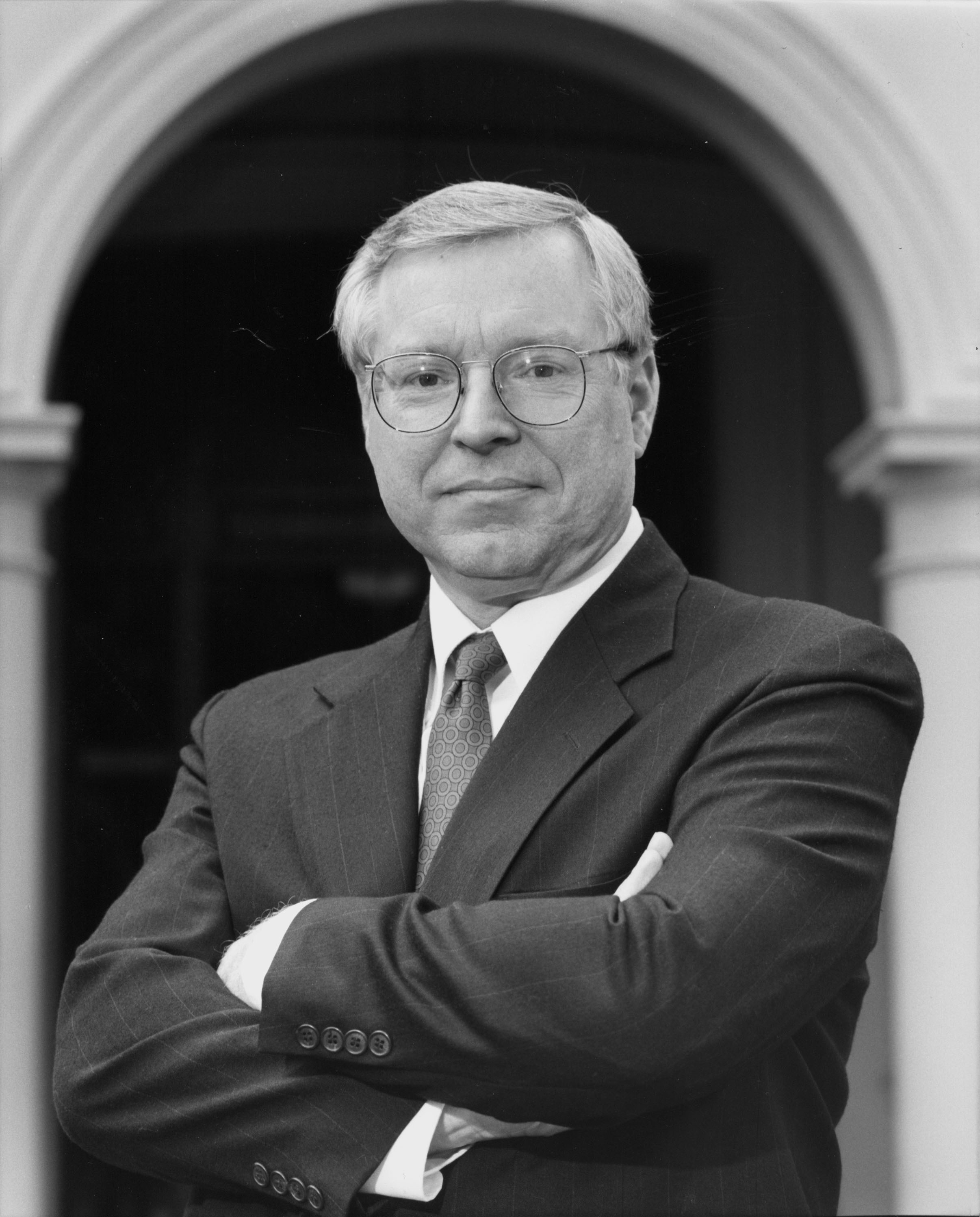 BW portrait of man in a suit titled 